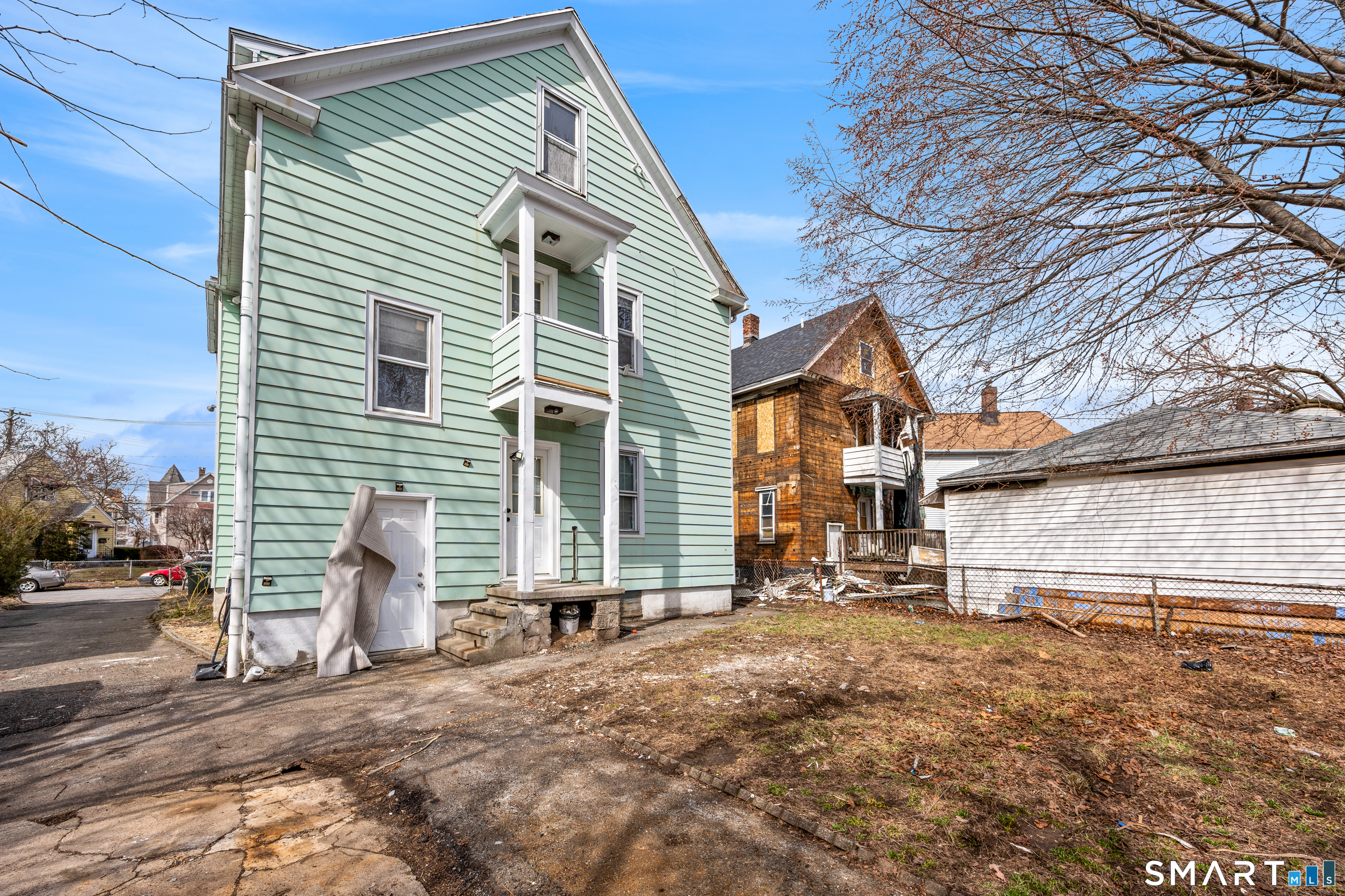 744 Park Street Bridgeport, CT 06608 - Photo 21 of 21 a view of a house with a yard and garage