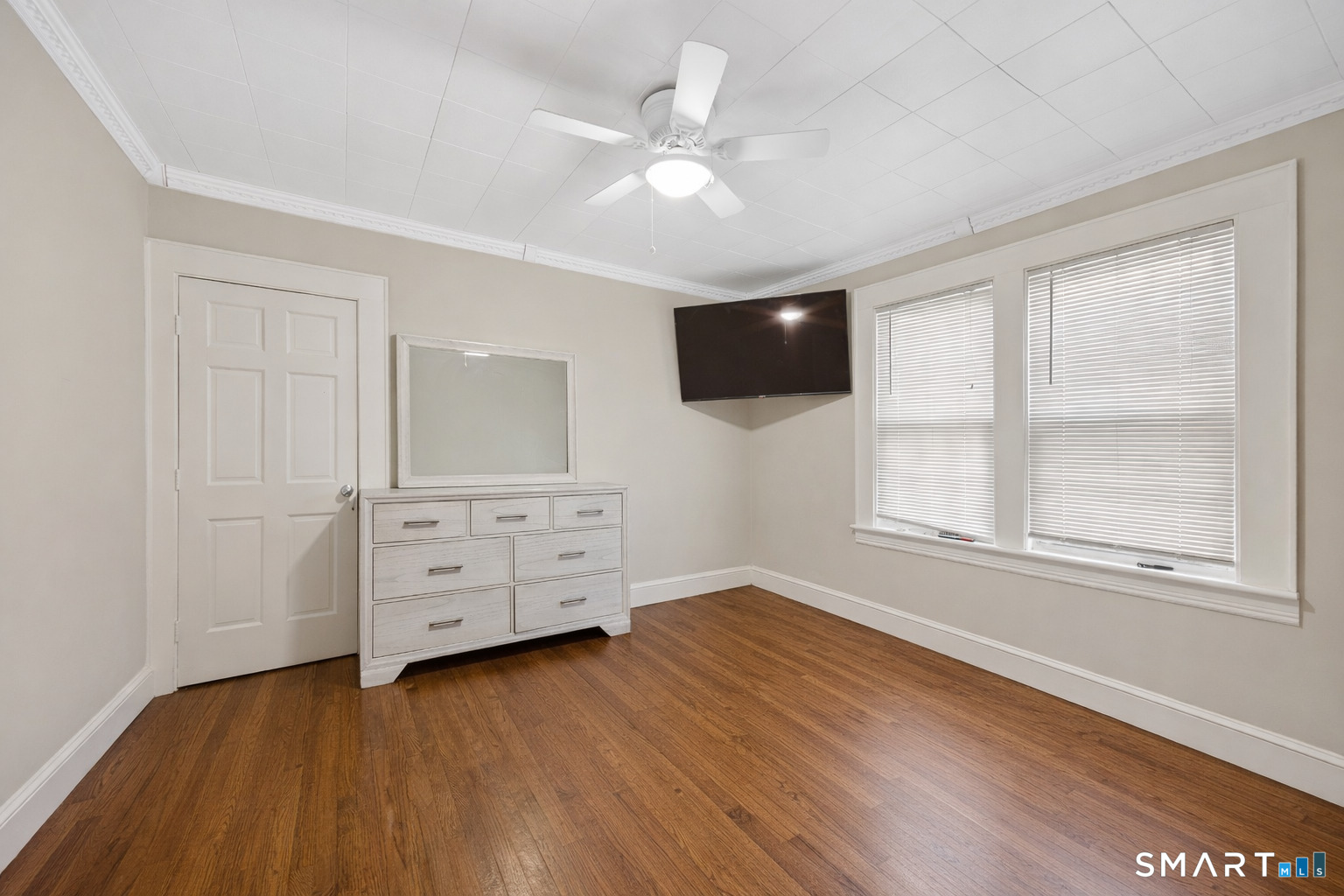 744 Park Street Bridgeport, CT 06608 - Photo 8 of 21 an empty room with windows and flat screen tv