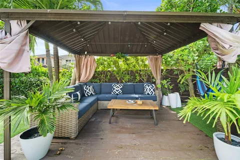 a view of a chairs and table in a patio