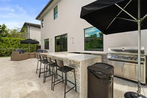 a kitchen with a table and chairs