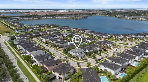 an aerial view of a residential building and lake view