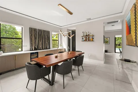 a view of a dining room with furniture and window