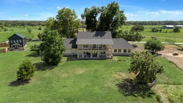 a kitchen with stainless steel appliances granite countertop a lot of counter space and wooden floors