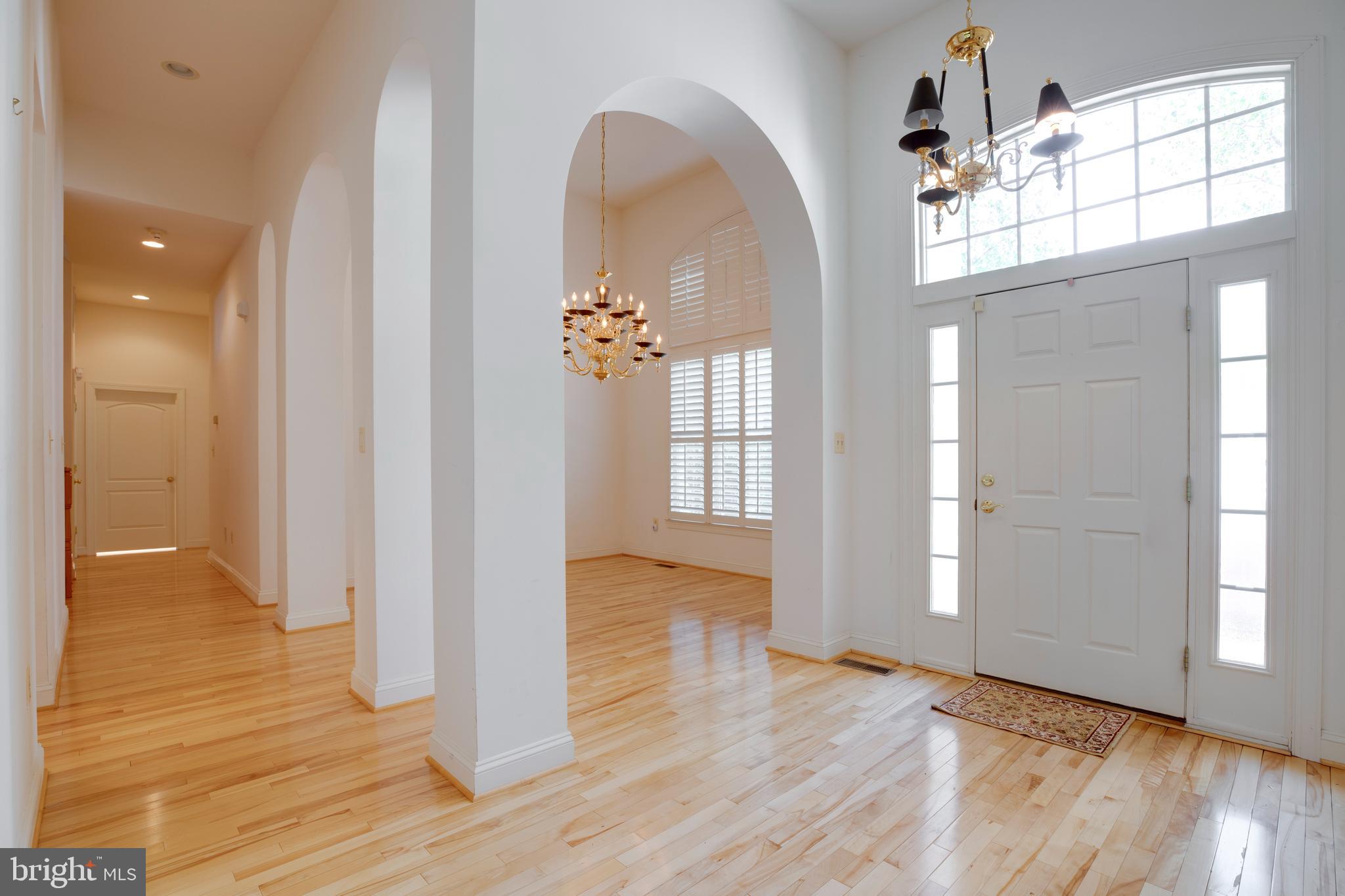 8277 Roxborough Loop Gainesville, VA 20155 - Photo 2 of 85 a view of a room with wooden floor and cabinet