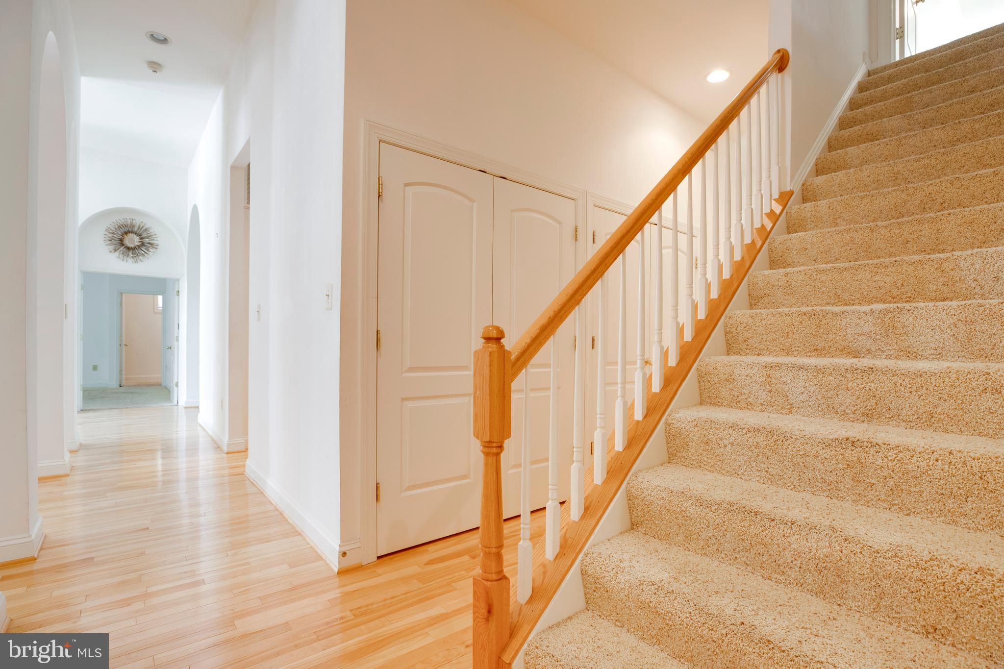 8277 Roxborough Loop Gainesville, VA 20155 - Photo 24 of 85 a view of staircase with wooden floor and staircase