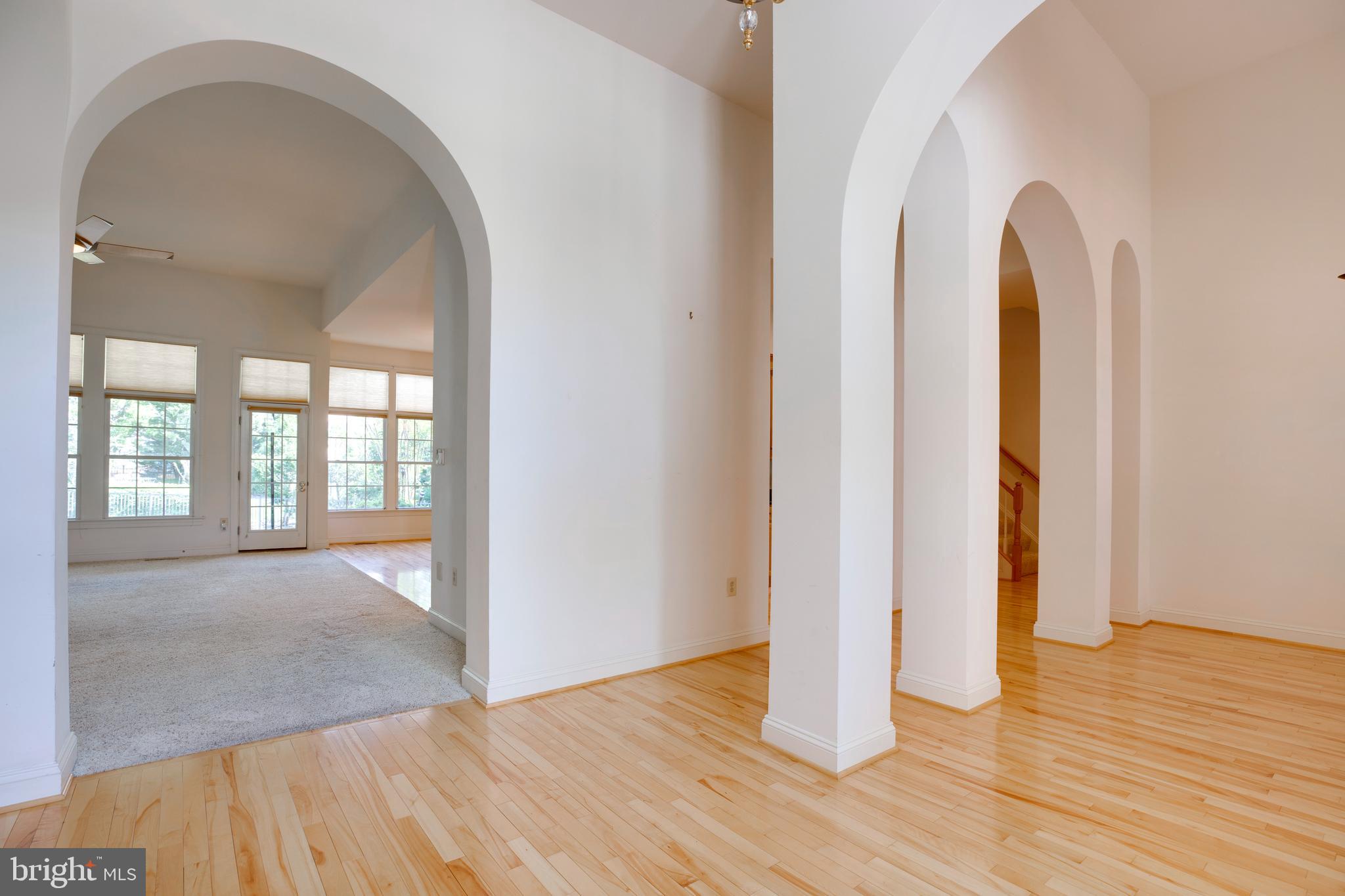 8277 Roxborough Loop Gainesville, VA 20155 - Photo 3 of 85 a view of a room with wooden floor and bathroom