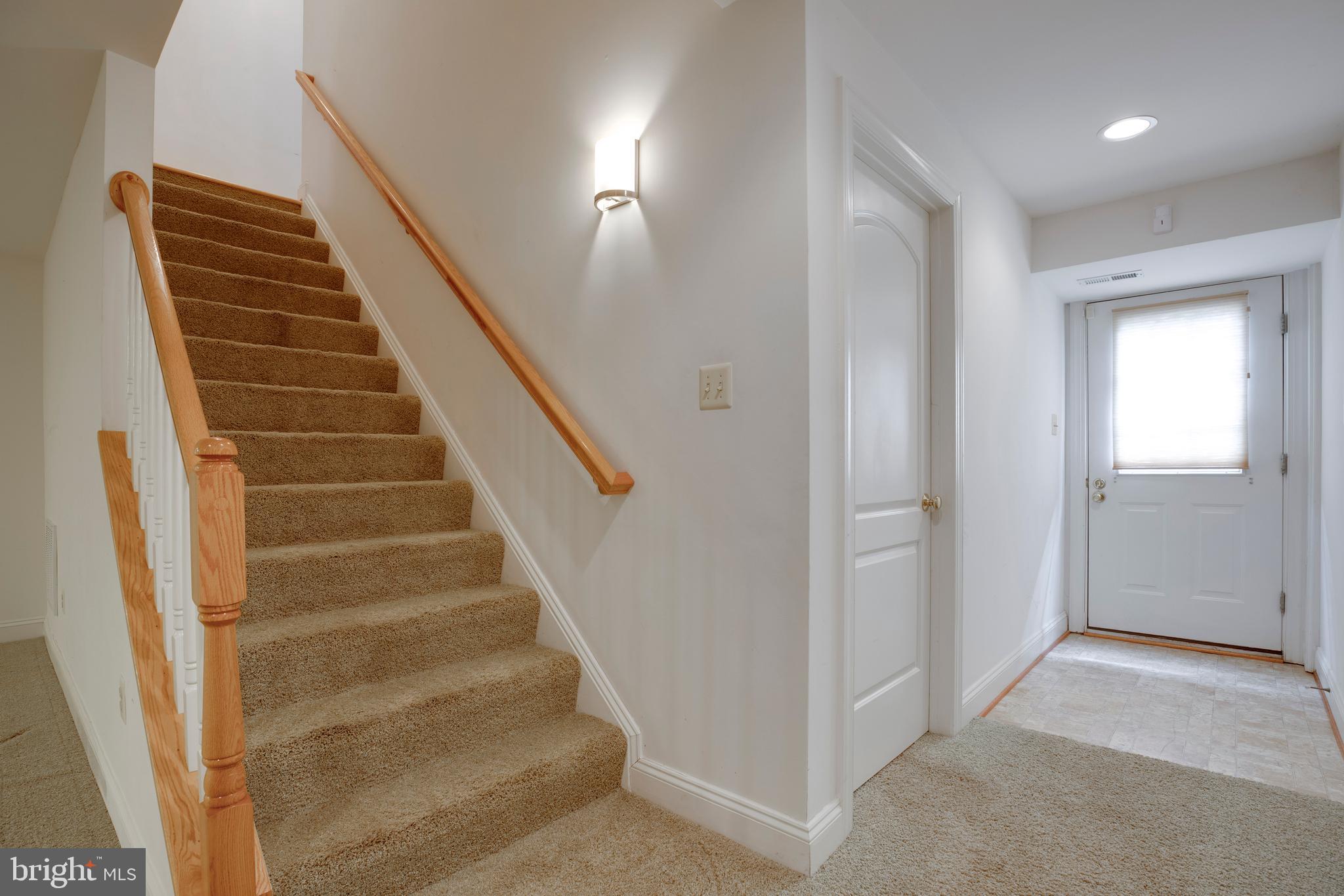 8277 Roxborough Loop Gainesville, VA 20155 - Photo 51 of 85 a view of an entryway with staircase