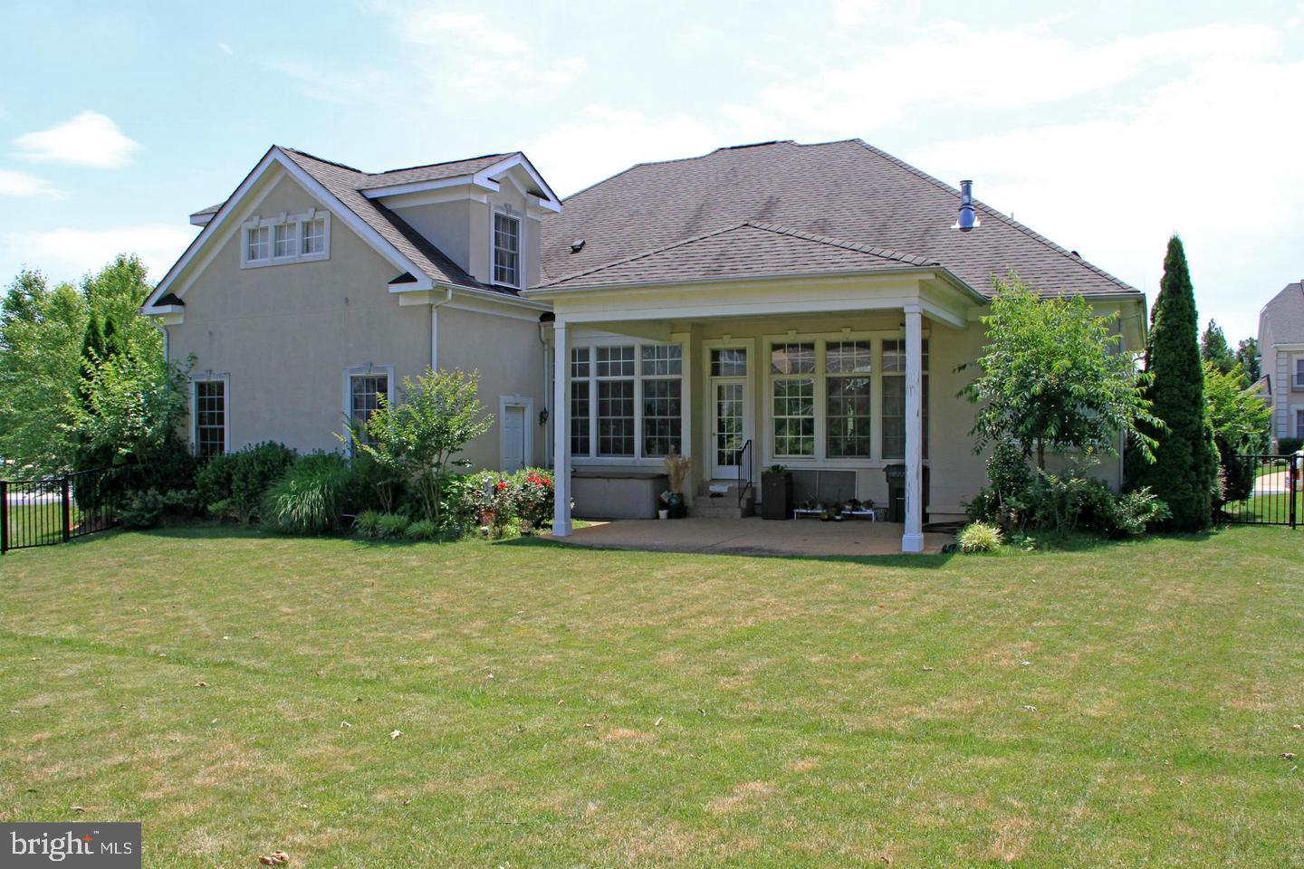 8277 Roxborough Loop Gainesville, VA 20155 - Photo 71 of 85 a view of a house with backyard and garden