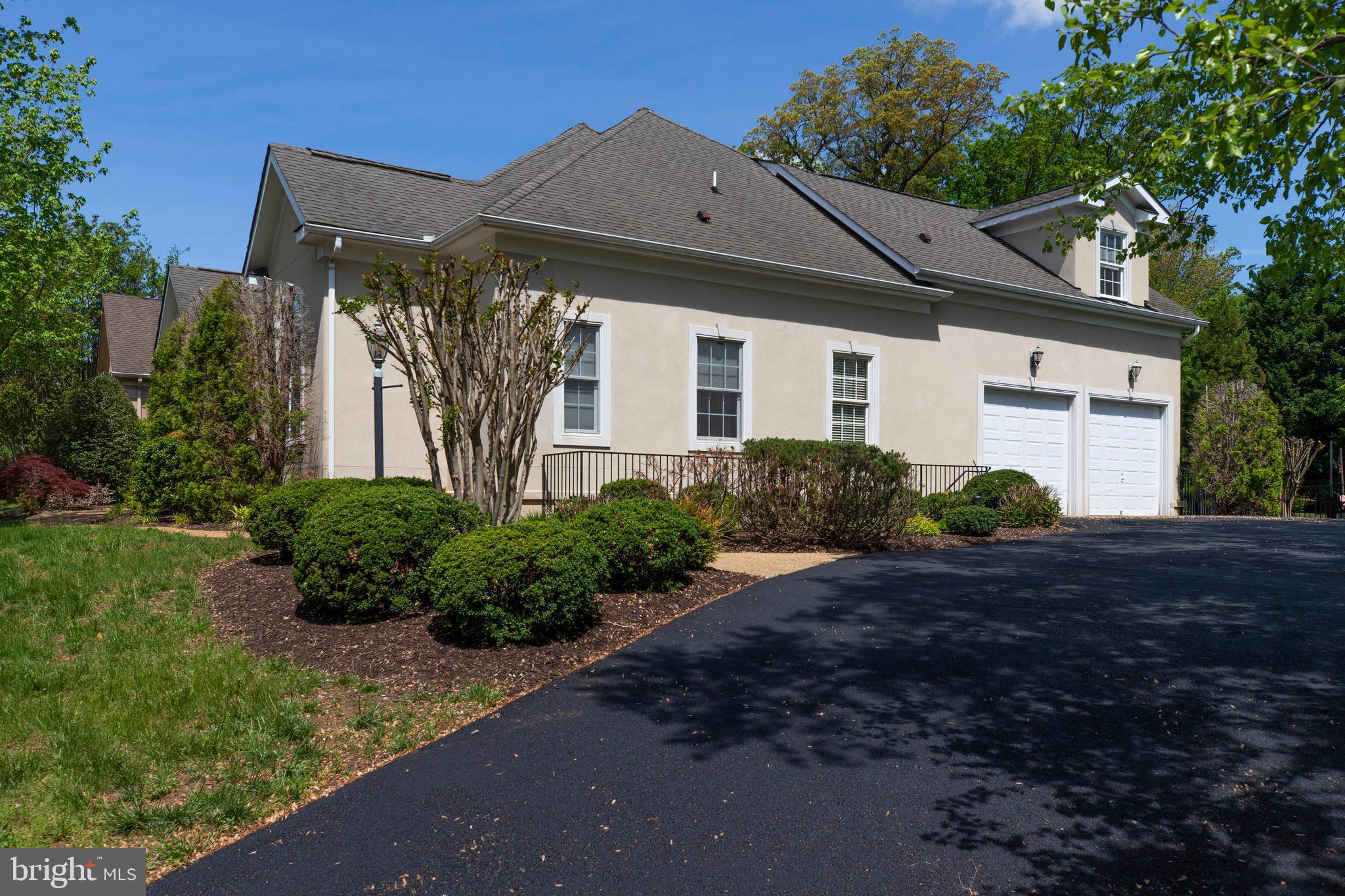 8277 Roxborough Loop Gainesville, VA 20155 - Photo 74 of 85 a front view of a house with a yard