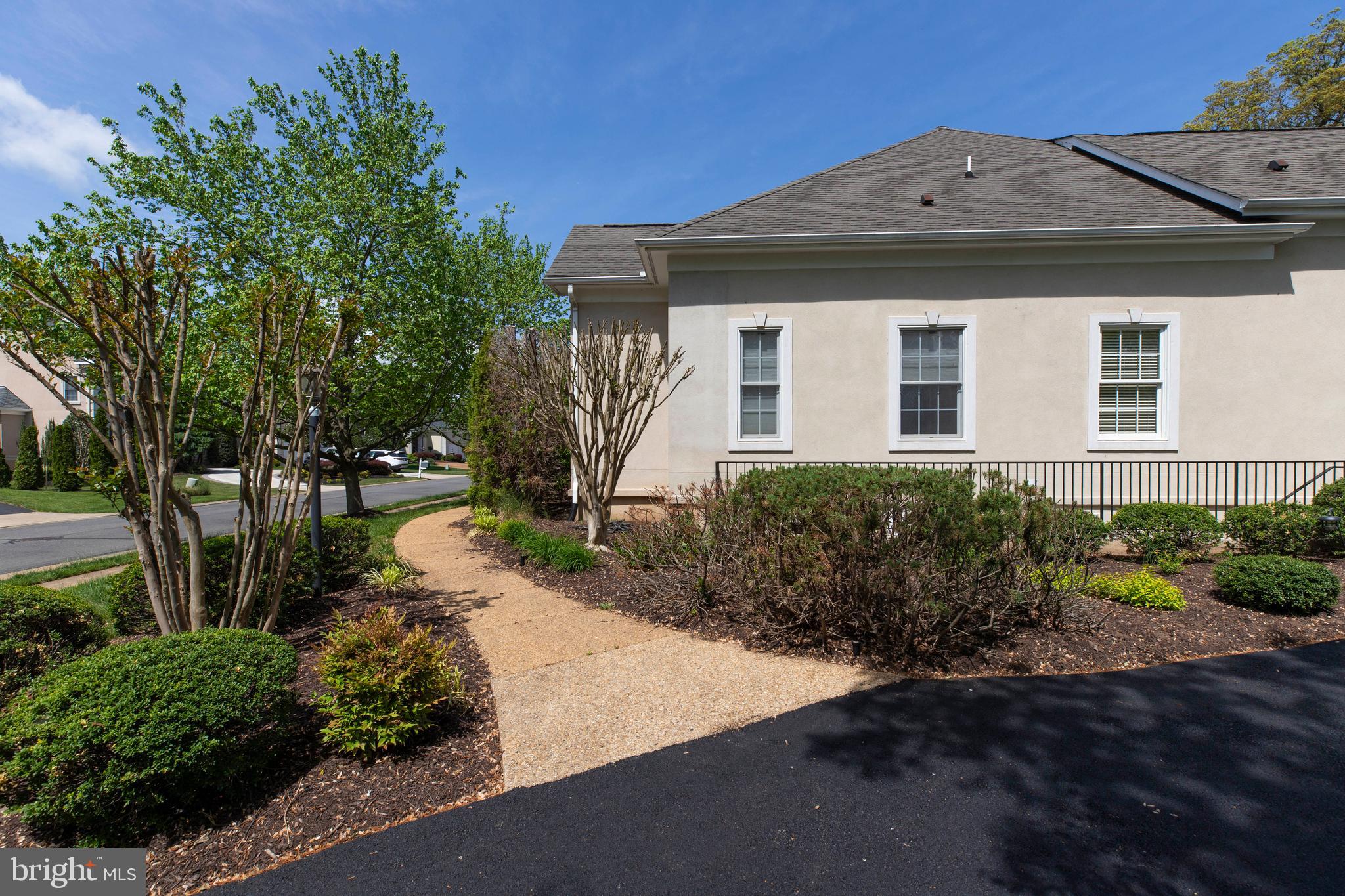 8277 Roxborough Loop Gainesville, VA 20155 - Photo 76 of 85 a front view of a house with a yard