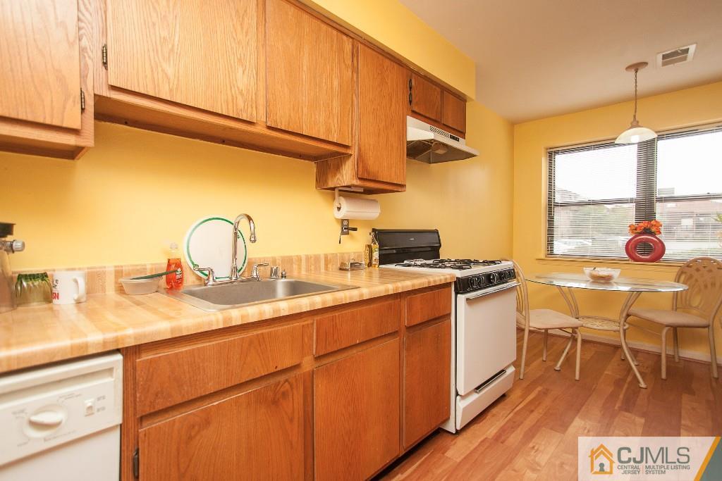 1525 Raspberry Court Edison, NJ 08817 - Photo 3 of 4 a kitchen with a sink cabinets and appliances