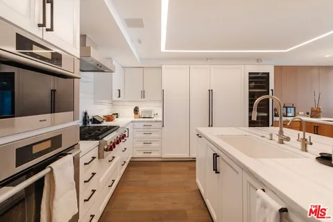 a spacious bedroom with a bed and a large window