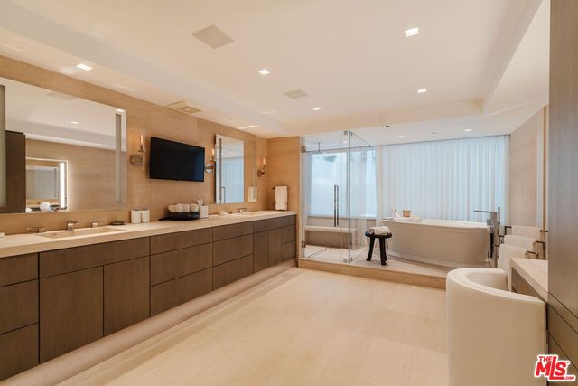 a bathroom with a tub sink and toilet