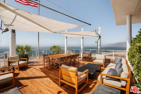 a view of a lake with sitting area