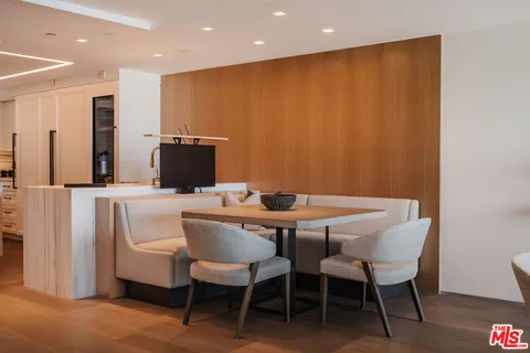 a kitchen with stainless steel appliances granite countertop a sink and a refrigerator