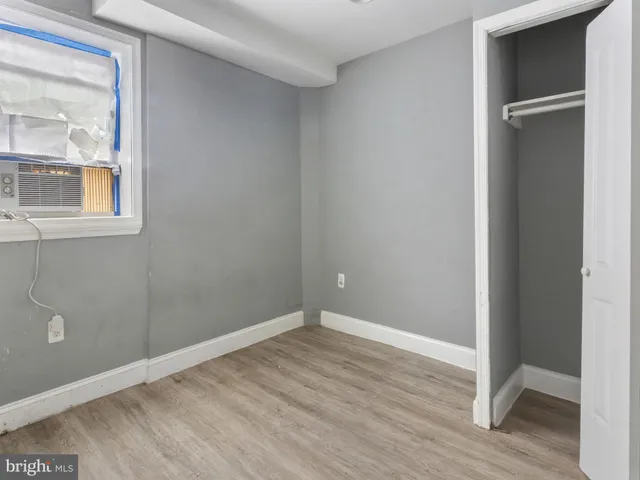 an empty room and entrance door