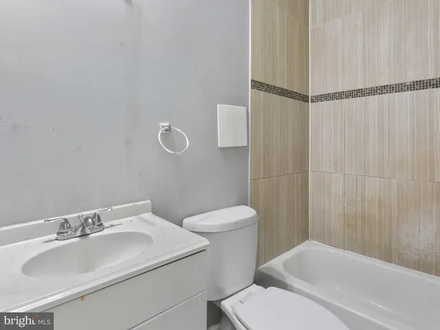 a view of a patio with table and chairs and wooden floor