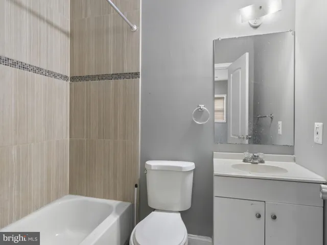 a front view of a house with a fence