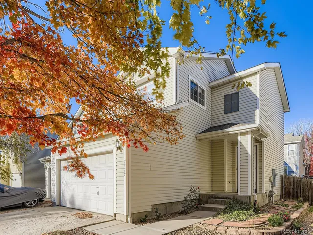 a kitchen with granite countertop a sink cabinets and stainless steel appliances