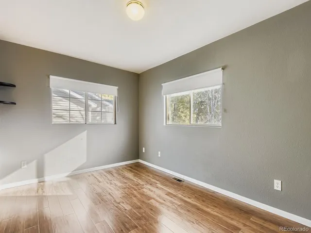 a view of a wooden roof with wooden floor and fence