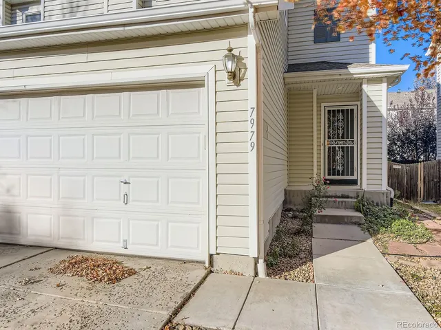 a view of a kitchen cabinets a sink and wooden floor