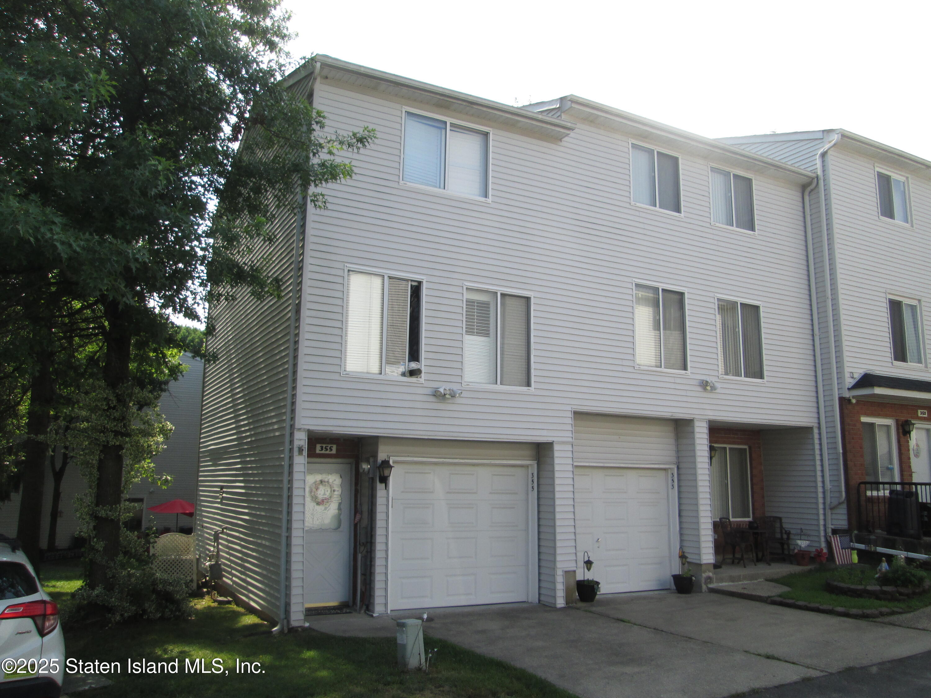 355 Ilyssa Way Staten Island, NY 10312 - Photo 1 of 12 a front view of a house with plants
