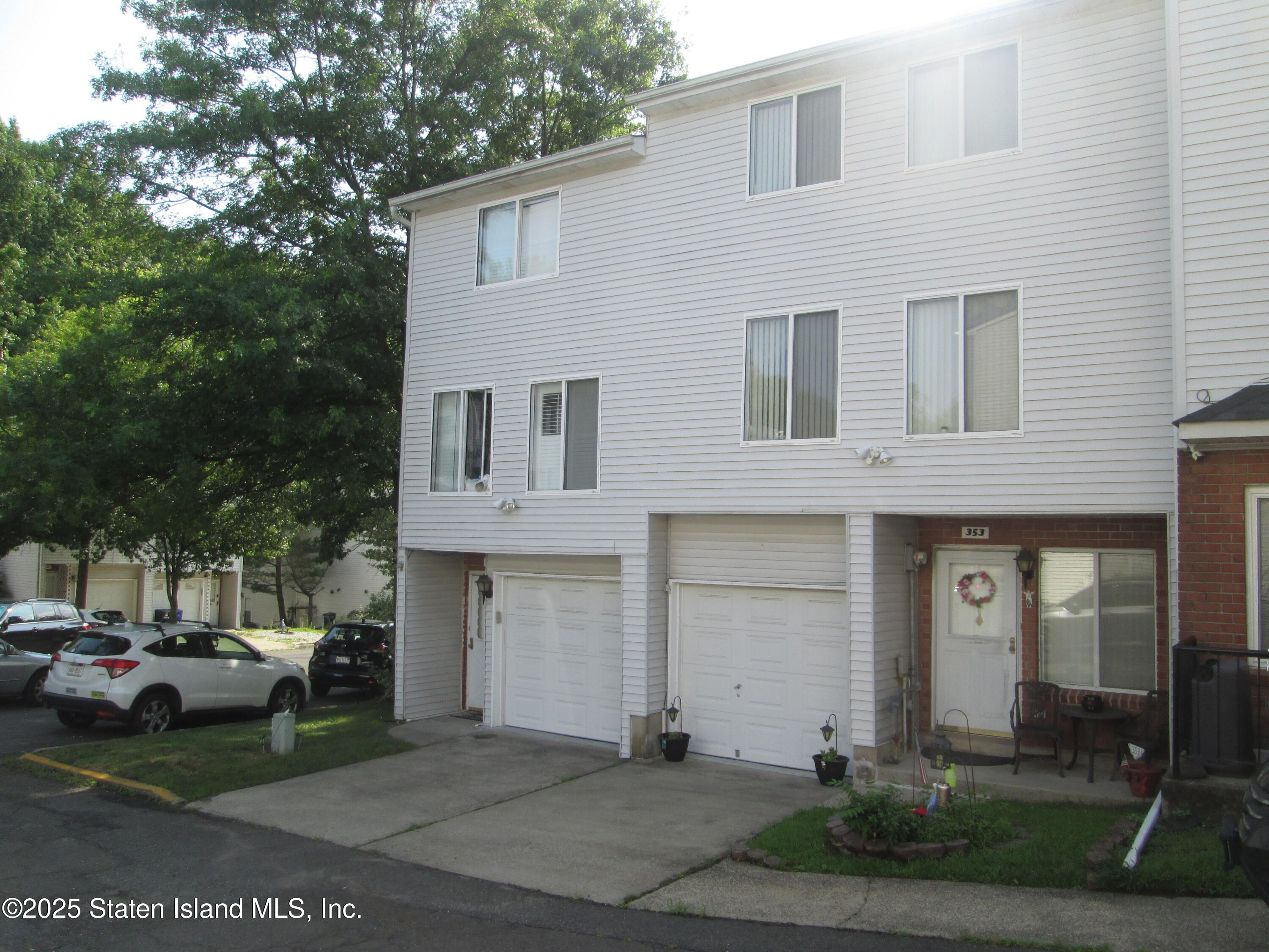 355 Ilyssa Way Staten Island, NY 10312 - Photo 2 of 12 a front view of a house with a yard