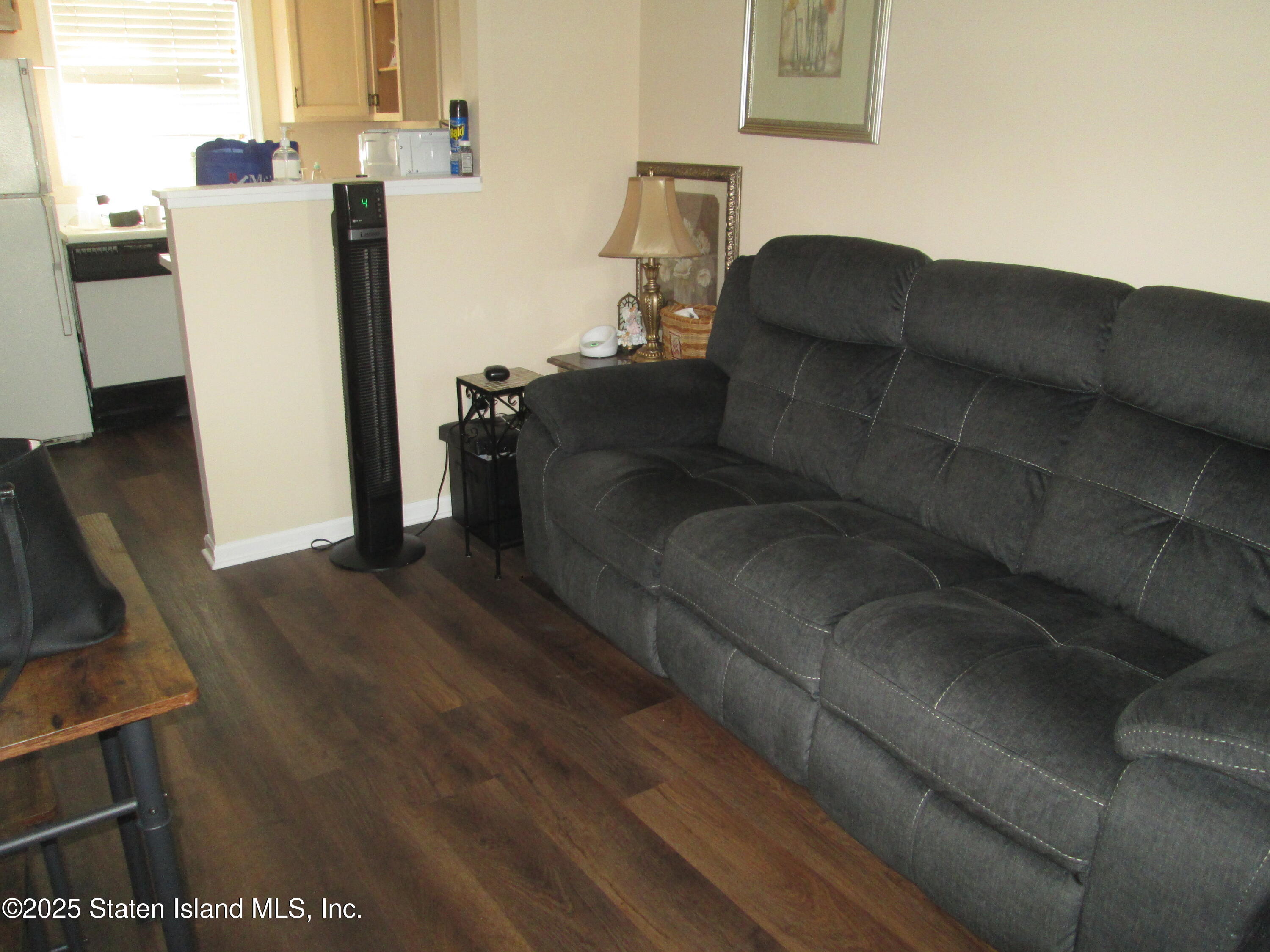 355 Ilyssa Way Staten Island, NY 10312 - Photo 4 of 12 a living room with furniture and a flat screen tv