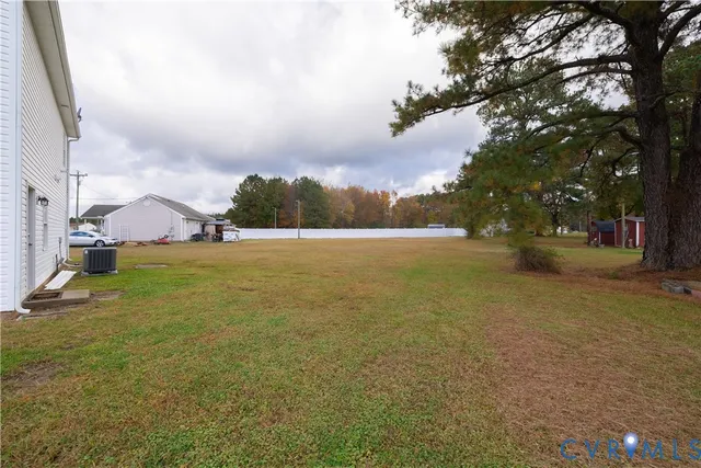 a view of outdoor space with swimming pool and green space