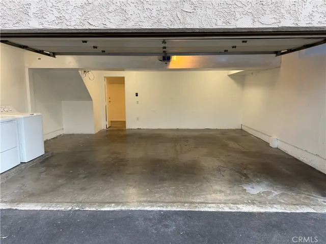 a front view of a house with parking space