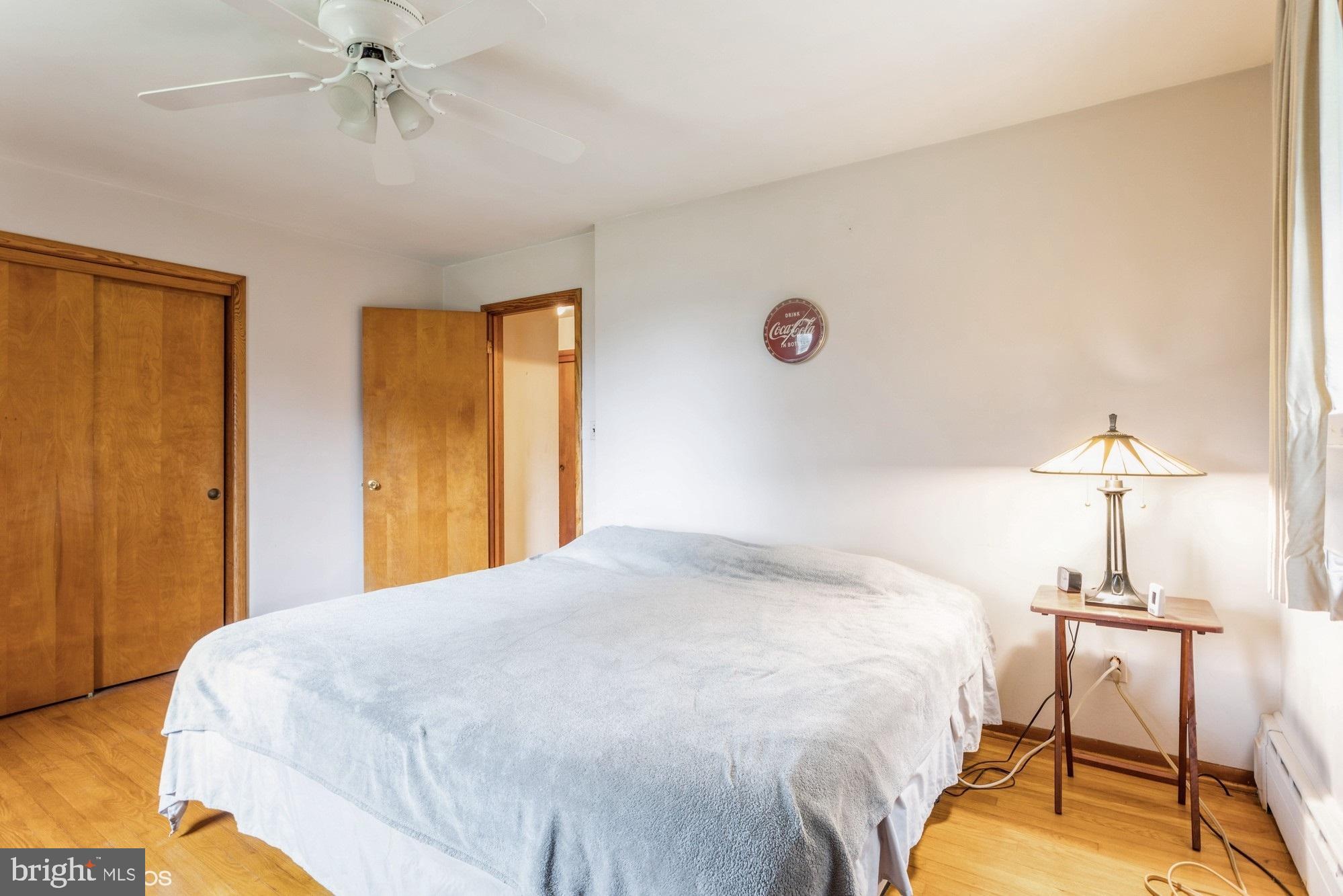 505 Whitaker Mill Road Fallston, MD 21047 - Photo 29 of 49 a bedroom with a bed and a chandelier