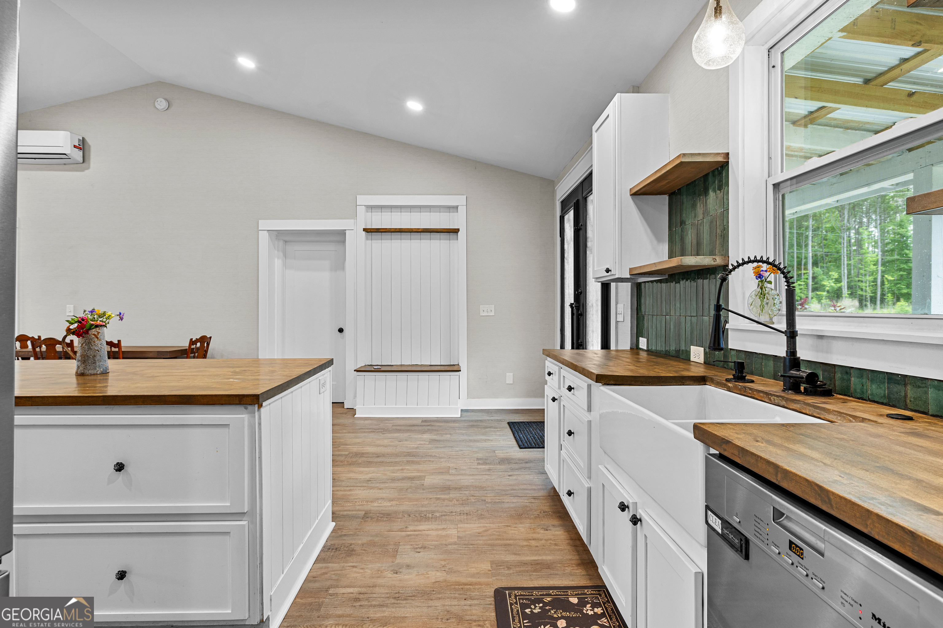 1329 Standing Rock Road Senoia, GA 30276 - Photo 28 of 77 a kitchen with granite countertop a sink and cabinets
