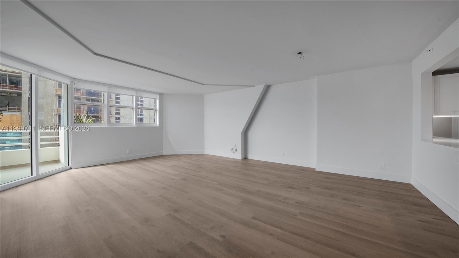 555 Northeast 34th Street, Unit 603 Miami, FL 33137 - Photo 13 of 28 a view of an empty room with a window