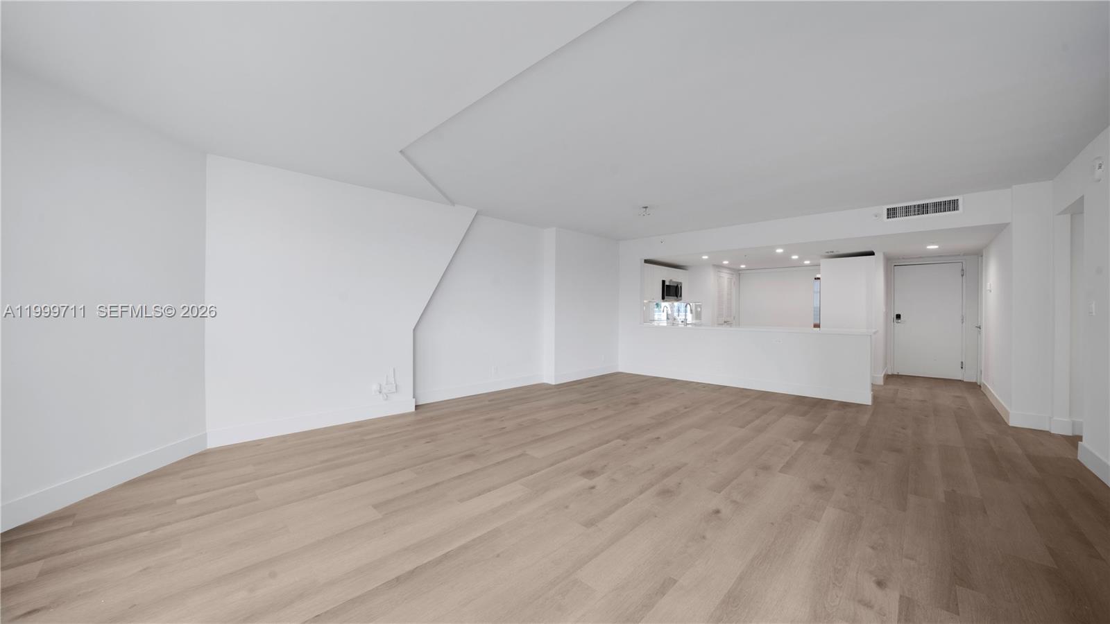 555 Northeast 34th Street, Unit 603 Miami, FL 33137 - Photo 14 of 28 a view of empty room with wooden floor