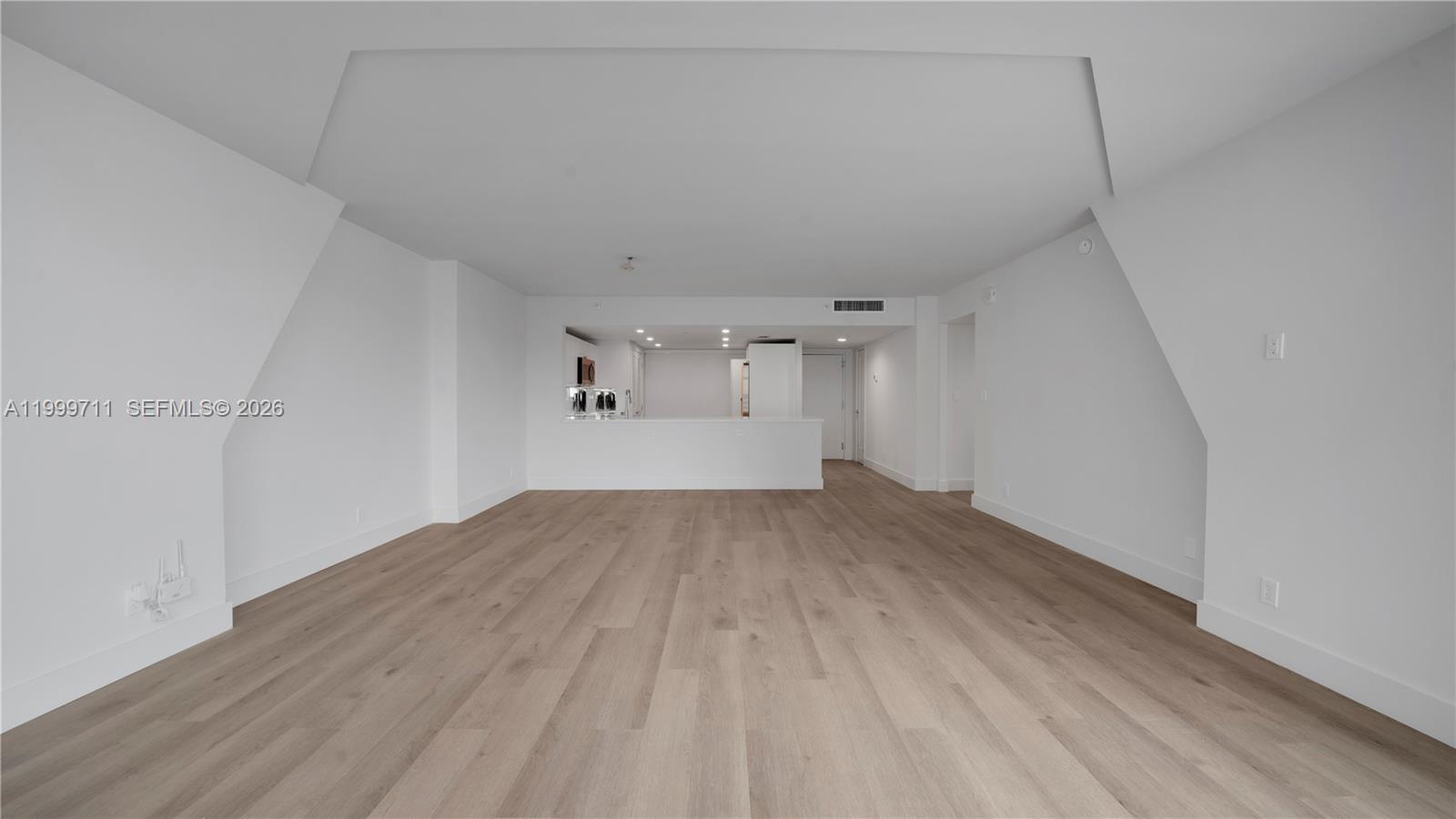 555 Northeast 34th Street, Unit 603 Miami, FL 33137 - Photo 15 of 28 a view of empty room with wooden floor