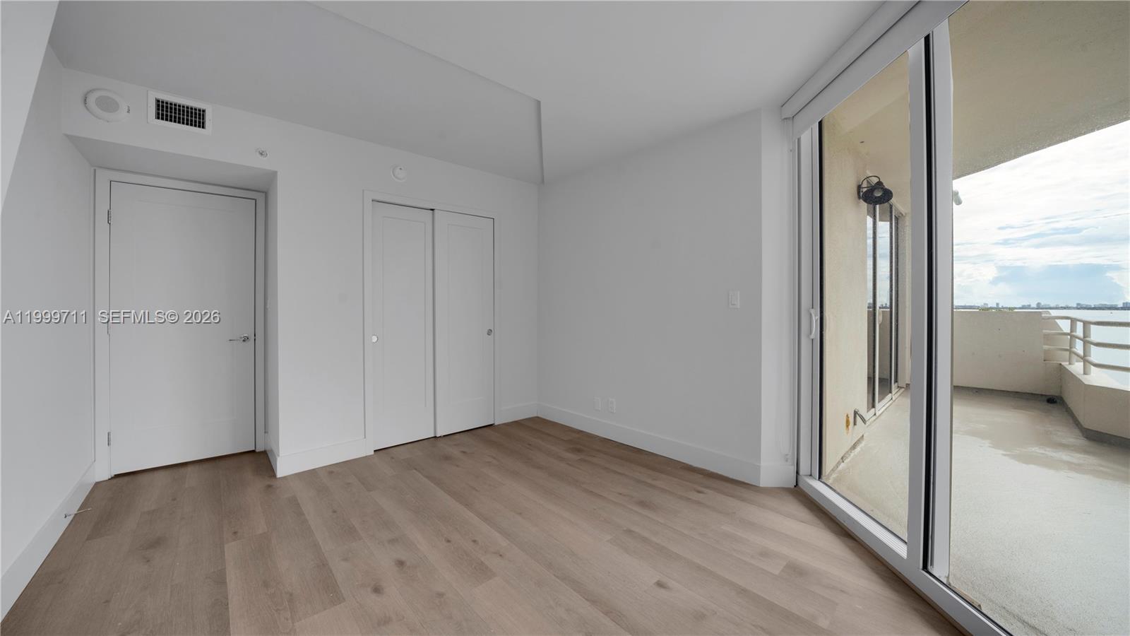 555 Northeast 34th Street, Unit 603 Miami, FL 33137 - Photo 25 of 28 a view of an empty room and a window