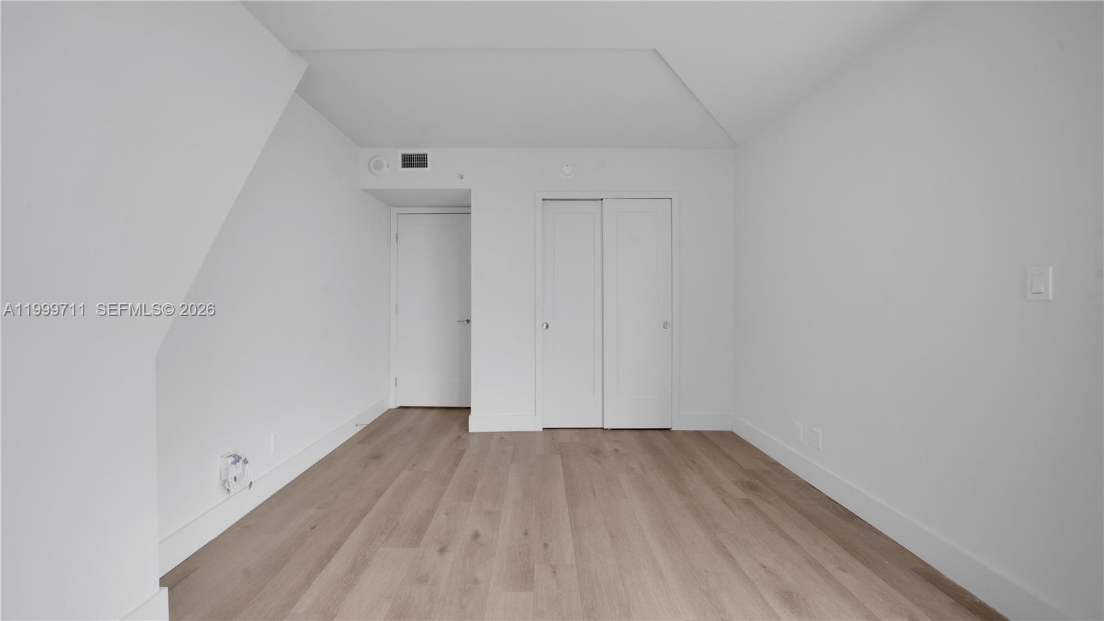555 Northeast 34th Street, Unit 603 Miami, FL 33137 - Photo 26 of 28 a view of a room with wooden floor