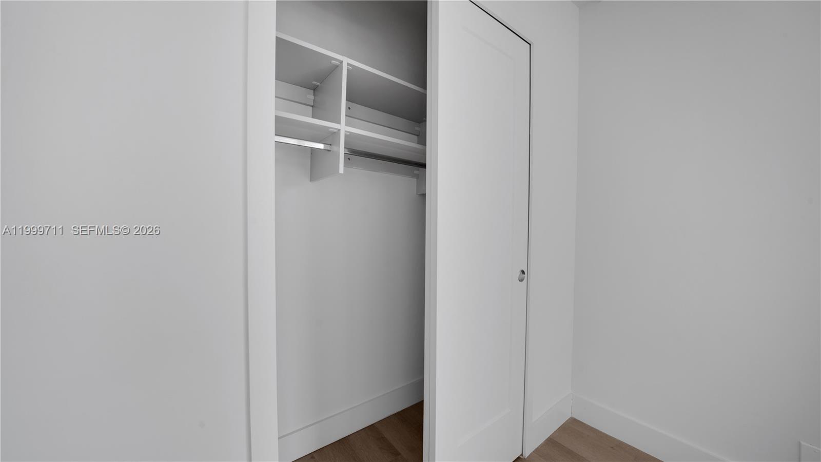 555 Northeast 34th Street, Unit 603 Miami, FL 33137 - Photo 27 of 28 a view of an empty walk in closet