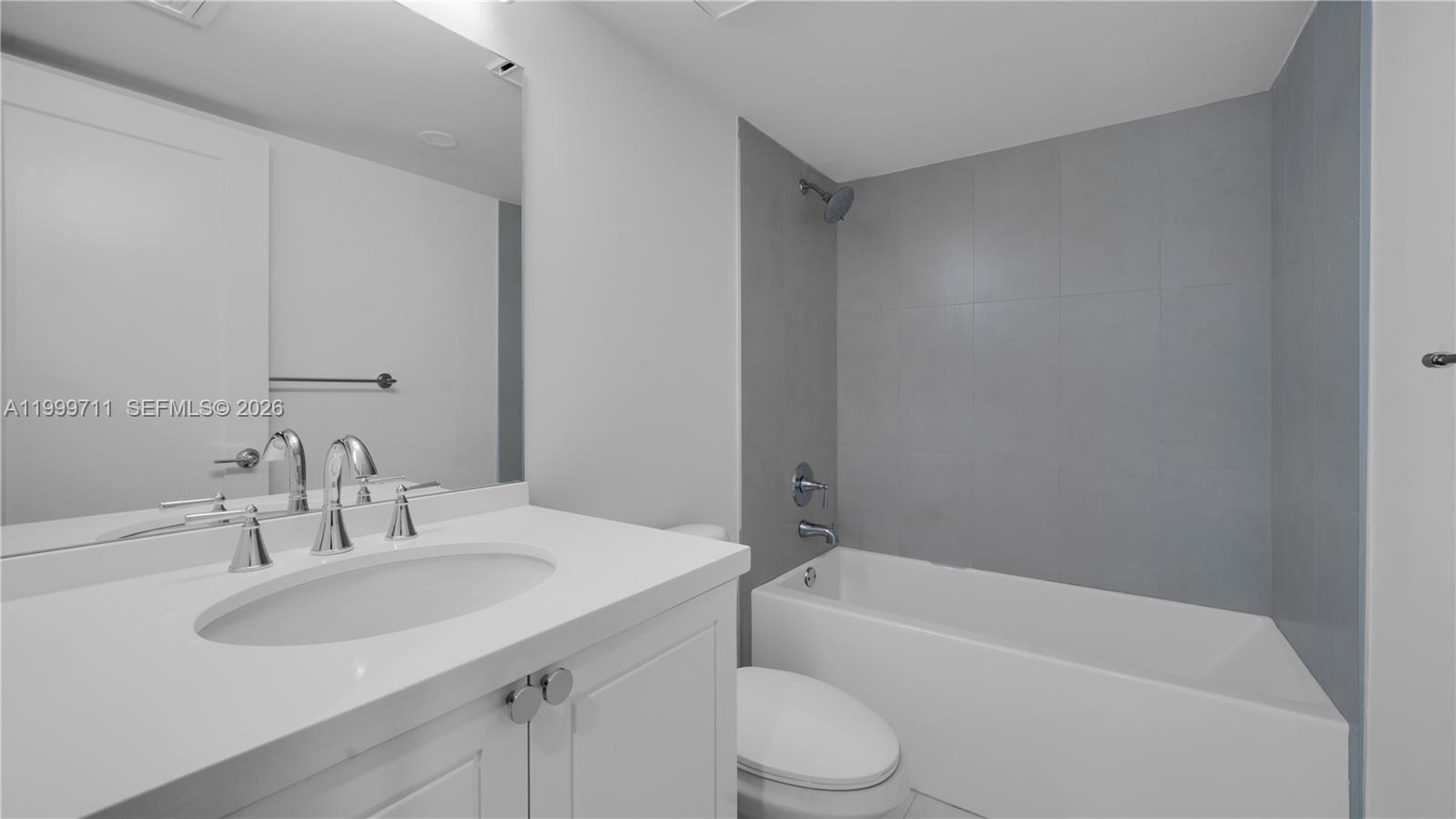 555 Northeast 34th Street, Unit 603 Miami, FL 33137 - Photo 28 of 28 a bathroom with a sink toilet and bathtub