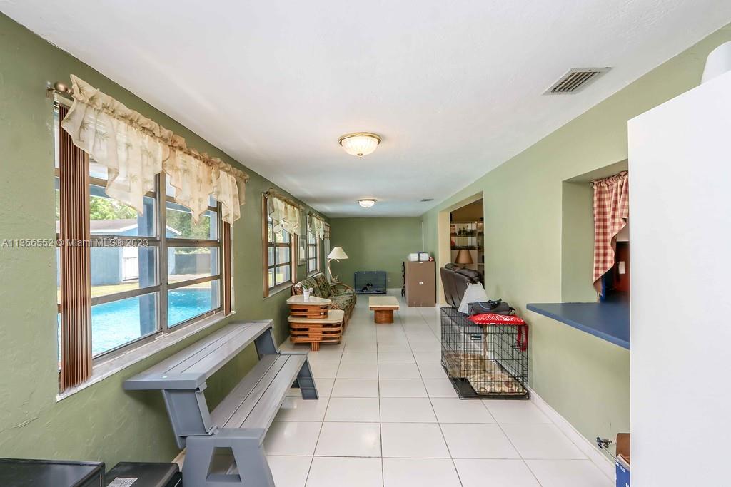 Redlands Homestead, FL 33031 - Photo 13 of 36 a living room with furniture and a flat screen tv