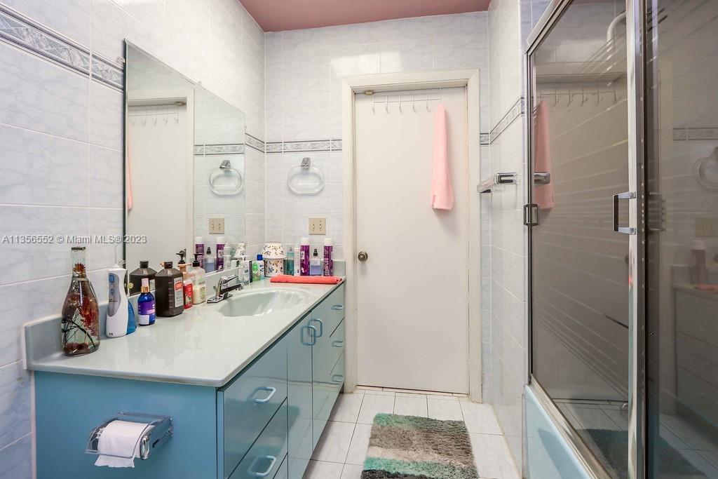 Redlands Homestead, FL 33031 - Photo 19 of 36 a bathroom with a sink vanity and shower