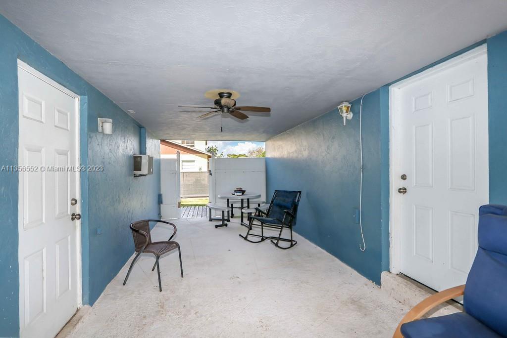 Redlands Homestead, FL 33031 - Photo 21 of 36 a view of a livingroom with furniture and chandelier fan