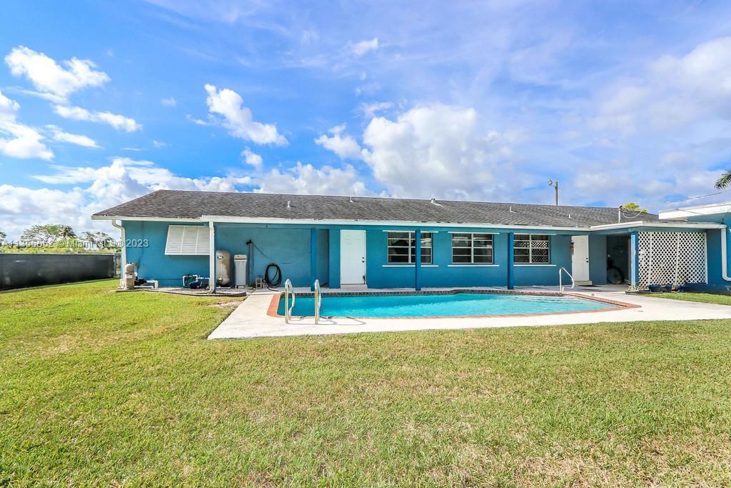 Redlands Homestead, FL 33031 - Photo 29 of 36 a front view of a house with a garden and porch