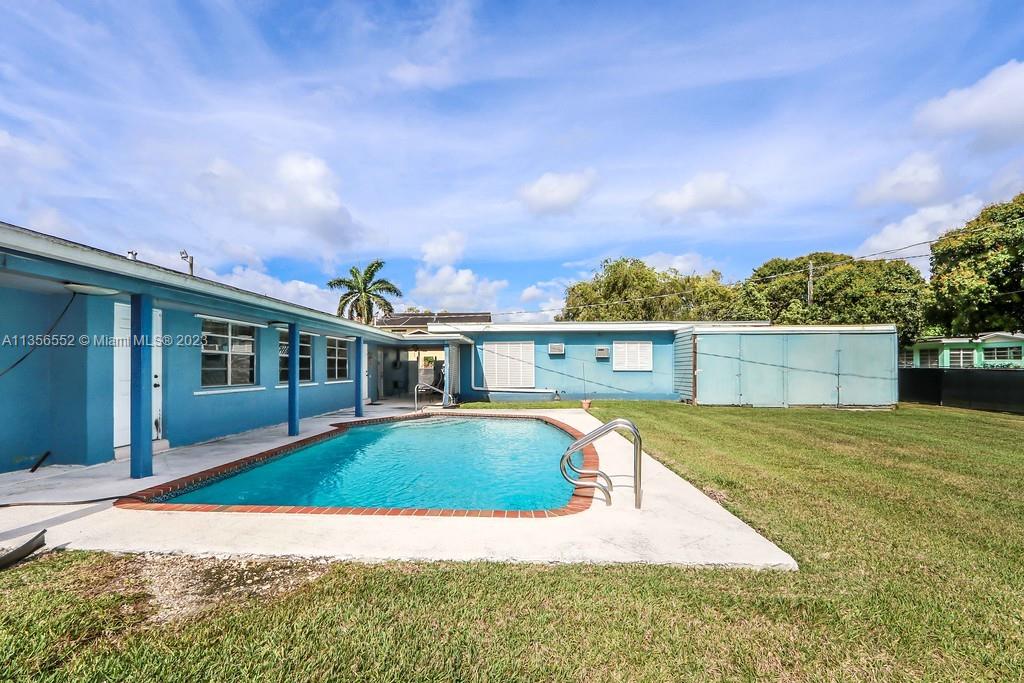 Redlands Homestead, FL 33031 - Photo 30 of 36 a view of a house with a swimming pool and a yard