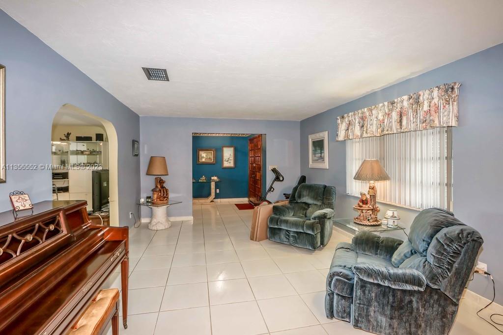Redlands Homestead, FL 33031 - Photo 6 of 36 a living room with furniture and a large window