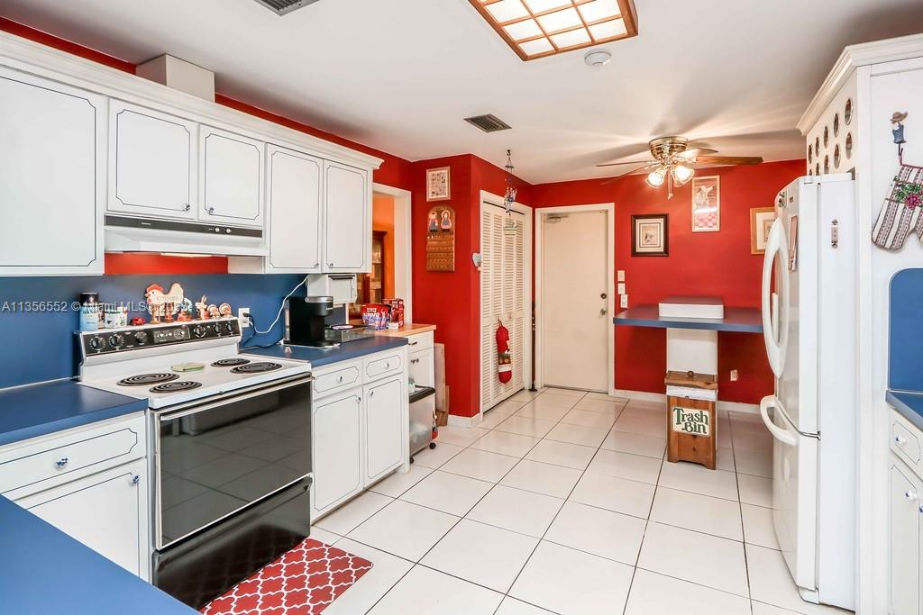 Redlands Homestead, FL 33031 - Photo 9 of 36 a kitchen with stainless steel appliances granite countertop a stove a sink and a refrigerator