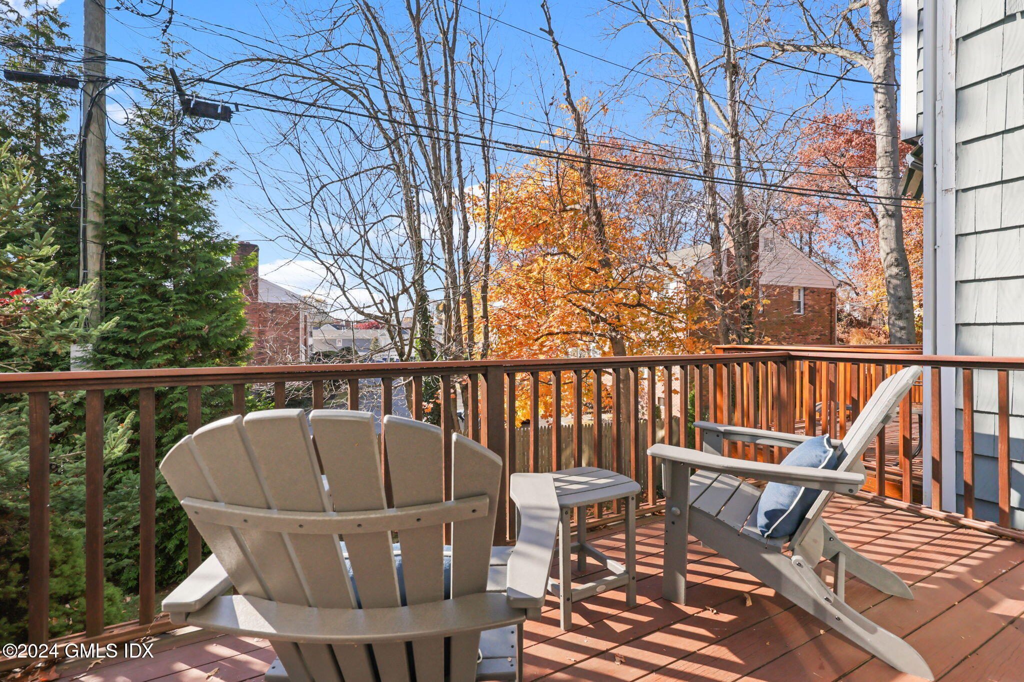 98 Valley Road, Unit 6 Cos Cob, CT 06807 - Photo 4 of 16 a view of a chairs and table on the deck