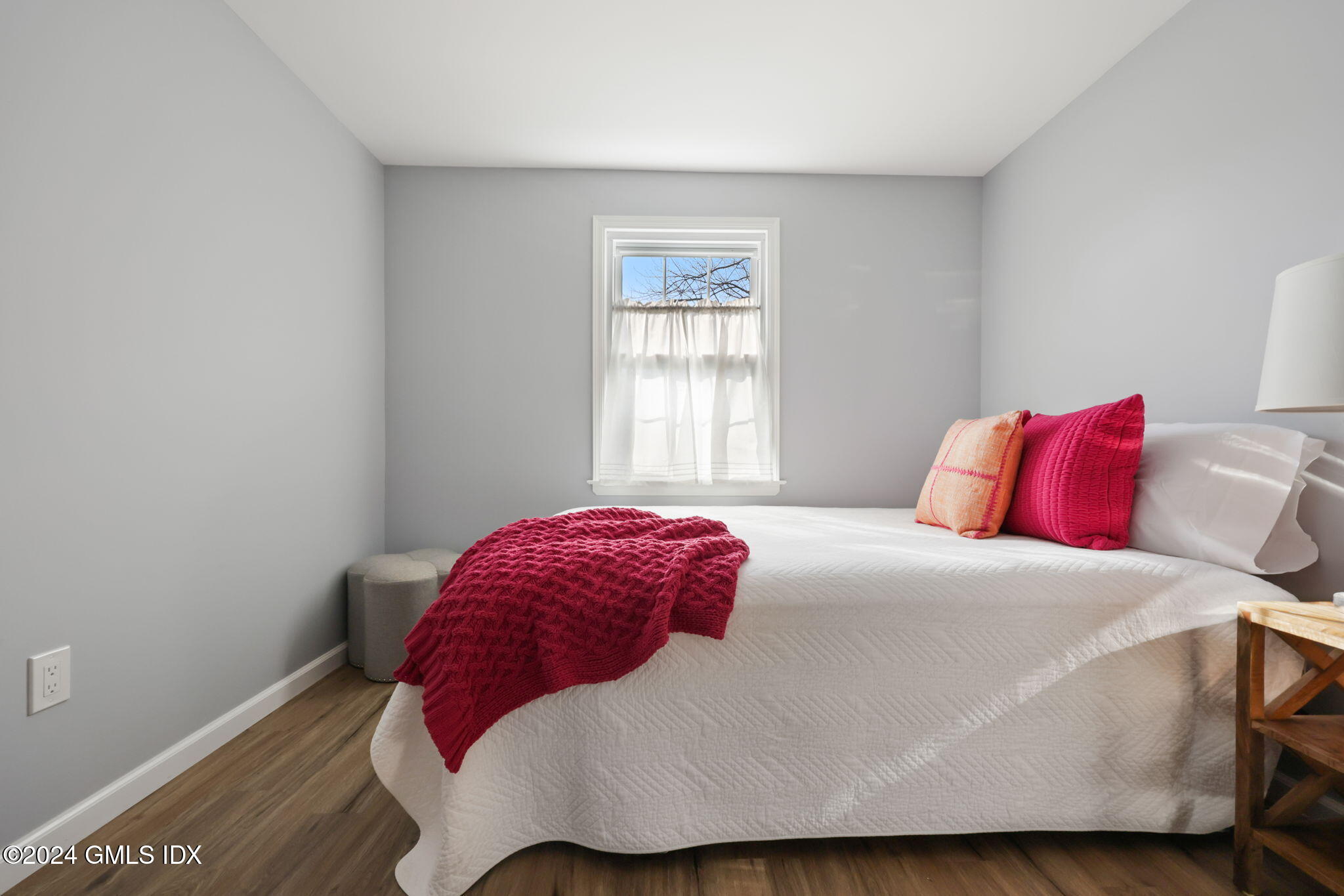 98 Valley Road, Unit 6 Cos Cob, CT 06807 - Photo 8 of 16 a bedroom with a bed and a window