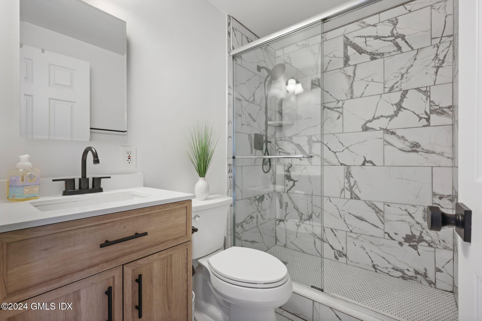 98 Valley Road, Unit 6 Cos Cob, CT 06807 - Photo 9 of 16 a bathroom with a sink toilet vanity and shower