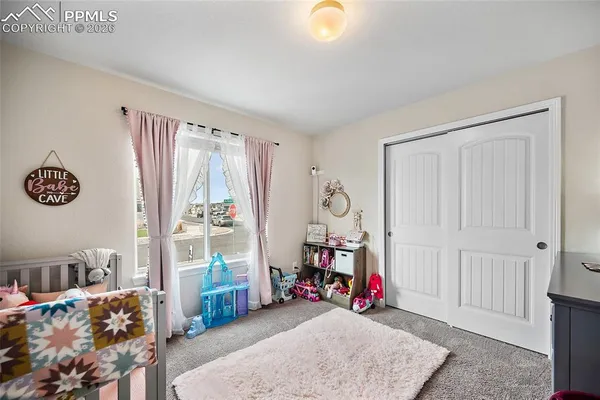 a view of a room with toys and closet